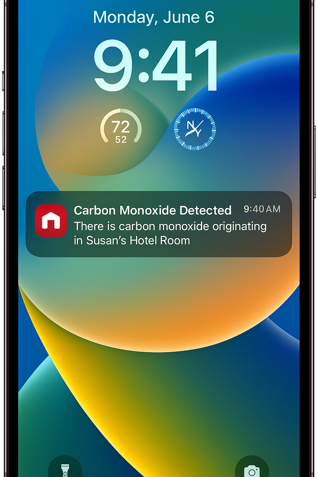 An iPhone lock screen displaying a push notification from the First Alert app reading Carbon Monoxide Detected, demonstrating remote monitoring capability for travelers.