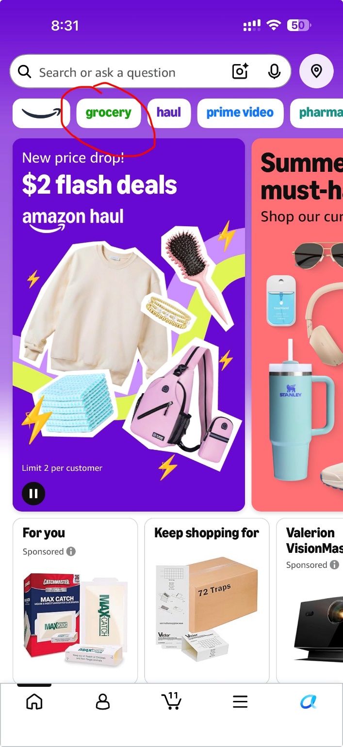 Amazon app home screen on an iPhone with the green grocery tab circled at the top.