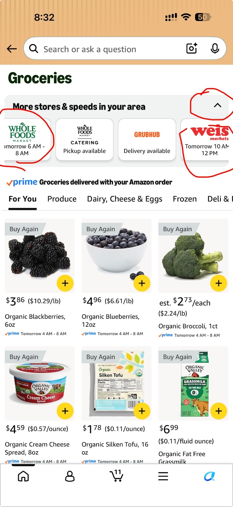 Amazon Groceries screen on an iPhone showing a store dropdown with Whole Foods Market Tomorrow 6 AM to 8 AM, and fresh produce with Prime delivery windows.